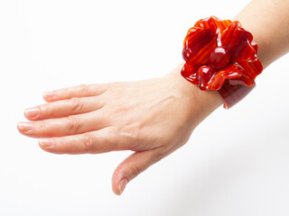 Woman's hand with a bracelet in the style of the 70s of the twentieth century.