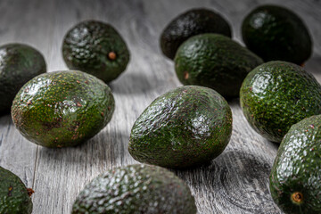 Extreme Close up of Avocados on a Grey Wood Surface