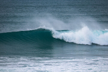 Perfect wave breaking in a beach. Surf spot