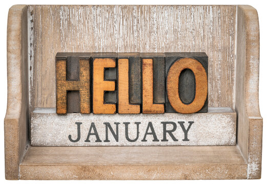 Hello January in vintage letterpress wood type inside grunge wooden box, calendar concept