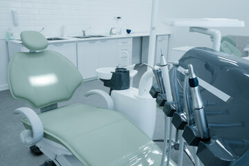 Dental chair and equipment. Patient reception room in a modern medical center.
