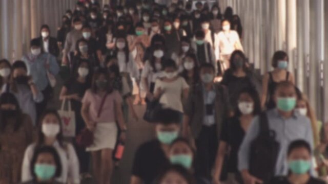 Defocused, Large Crowd Of Business People With Medical Face Mask. Air Pollution. Coronavirus, Covid 19 Quarantine, 