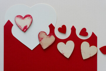 wooden hearts on fancy, abstract paper background