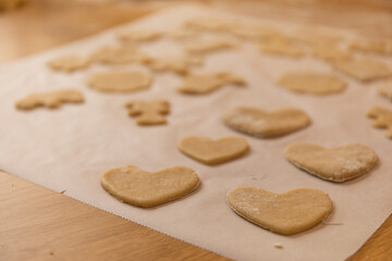 Fototapeta na wymiar many heart cookies ready to bake for valentine's day, close up