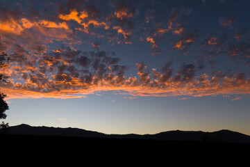 Silhouette landscape picture of mountain in dark and beautiful pink red sky