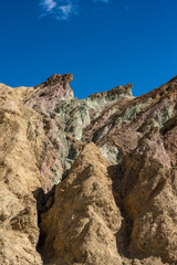 Multicolored Mountain Side Under a Blue Sky In Death Valley