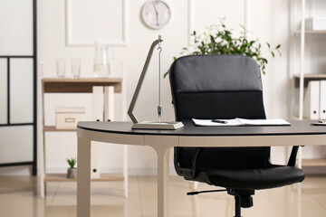 Modern pendulum on table in office