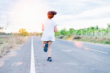 Athlete runner feet running on road.