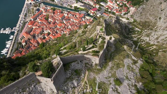 Aerial shot of the fortress St John San Giovanni over the Old Town of Kotor, the famous tourist spot in Montenegro.