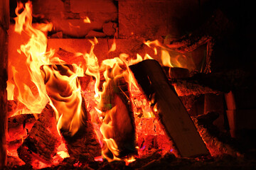 flame. Fire and flames Sparks and flames. Fireplace with logs and colorful flames.Multicolored flame.Firewood burning in bonfire.