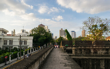 Walking on the old stone walls of a Spanish-era city. Intramuros, Manila, Philippines