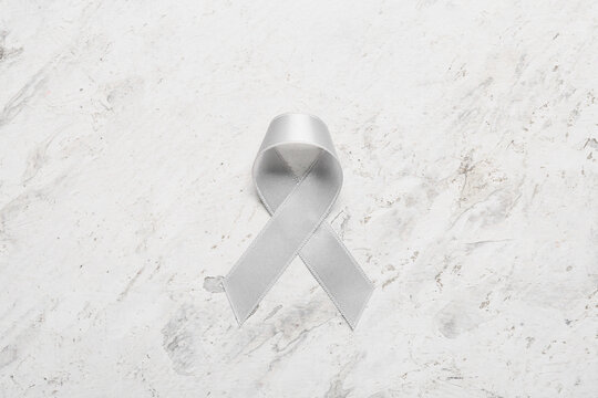 Parkinson's awareness ribbon on light background