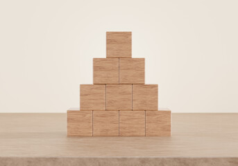 Blank wood cube arrange in pyramid on wooden floor background. business concept, 3D rendering.