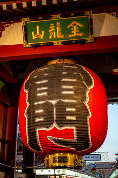 a huge red traditional lantern hanged on kaminarimon which is a gate of senso-ji in asakusa, tokyo