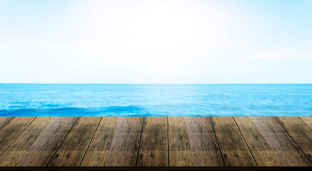 Naklejka na ściany i meble Beautiful wooden floor and blue background, sea water and sky.