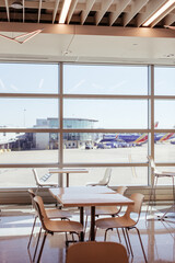 Empty seats in a deserted airport terminal