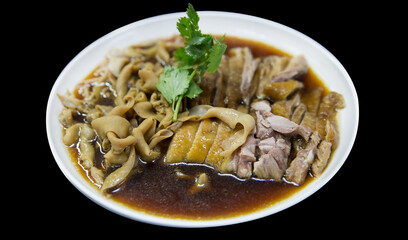 Die cut of Stewed Duck, duck meat and Duck Intestine, with Black Soy Sauce on black isolated.