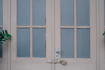 white window on blue wall