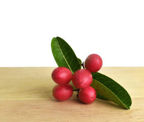 red currants on a wooden table