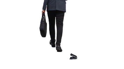 The lost wallet lies on isolated white background, and in the background are the legs of a...