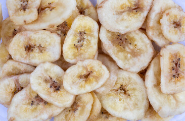 Background consisting of banana chips. Banana chips.