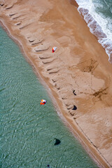 Fototapeta na wymiar Kite Surfers off Normandy Coast France