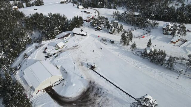 Tornik Ski Center, Zlatibor Mountain Resort. Serbia. Aerial View of White Winter Landscape, Snow Capped Hills and Pine Forest - Drone Shot