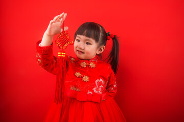A girl celebrates Chinese New Year with a Chinese knot