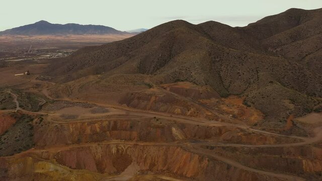 Roads used for heavy mining machinery in Copper Mine in Bisbee Arizona, drone backwards.