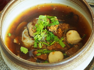 Traditional Chinese braised pork noodle soup serving in the bowl. Famous street food menu in Asia. 