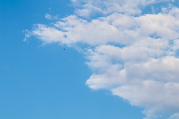 Background of blue sky with white clouds