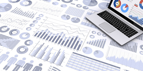 ビジネス資料とノートパソコン