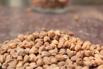 Bunch of unpeeled chickpeas on a tile