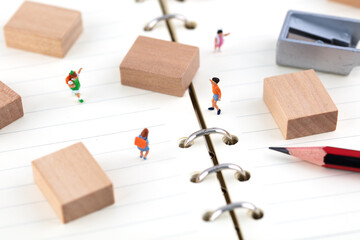 Small building blocks and pupils on the notebook
