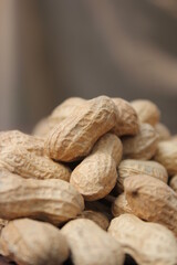 Bunch of unpeeled peanuts togather