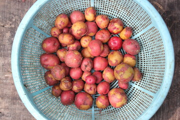 Fresh red potatoes on a bowl