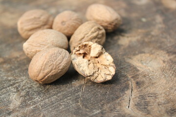 Dried nutmeg on a wooden table