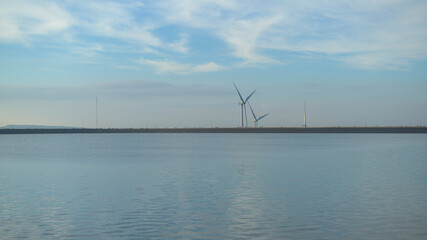 Fototapeta premium background of wind turbines at sunset..