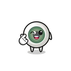 eyeball character doing Korean finger heart