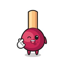 matches character doing Korean finger heart