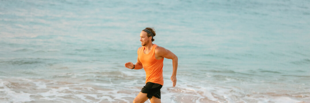 Fitness athlete man running fast sprinting on beach ocean water background banner. Profile of male runner explosive run with energy.