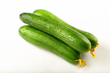 Fresh harvested raw green salad cucumbers.