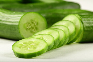 Sliced cucumber for salads on a white background. vegetable slices concepts.