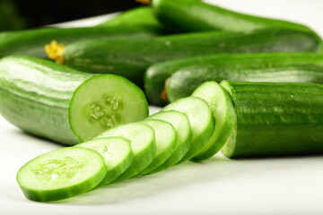 Sliced cucumber for salads on a white background. vegetable slices concepts.