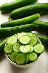 Healthy vegan diet appetizer foods- bowl of delicious fresh green cucumber salad with herbs.