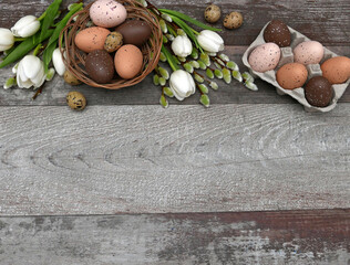 Easter background: flowers with Easter eggs