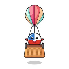 chile flag mascot riding a hot air balloon