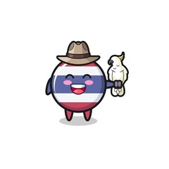 Obraz premium thailand flag zookeeper mascot with a parrot