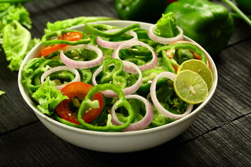 Healthy vegetarian diet meal- fresh green capsicum , paprika salad.