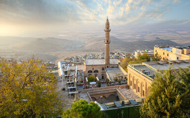 The Old city of Mardin, Turkey at sunrise. Cityscape view to the minaret of the Grand mosque	